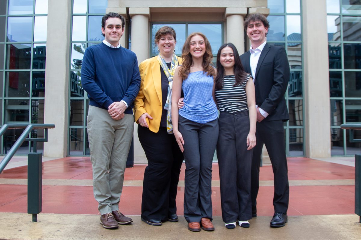 Tippie Fiscal Challenge group poses in front of Tippie in Iowa City, Iowa on Wednesday, April 15, 2026. They won the Fiscal Challenge National Championship located in Washington D.C. (Andy Espineira/The Daily Iowan)