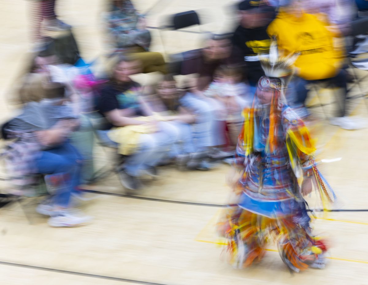 Dancers participate in the intertribal dance during the Iowa Powwow at the Fieldhouse in Iowa City on April 18, 2026. 