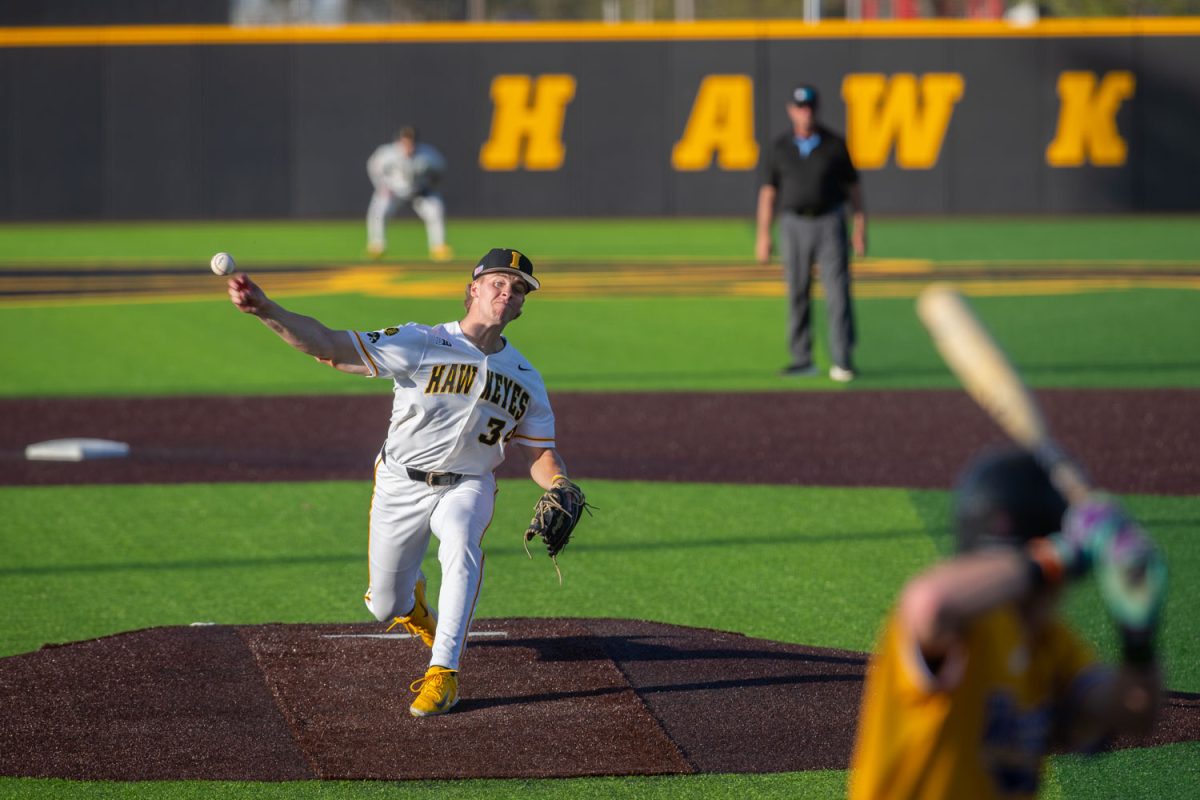 Iowa right-hand pitcher Cole Moore winds up a pitch in the baseball game between Iowa and Western Illinois at Duane Banks Field on Tuesday, April 21, 2026. The Hawkeyes won in the seventh-inning with a score of 22-3 over the Leathernecks. (Travis Crabb / The Daily Iowan)