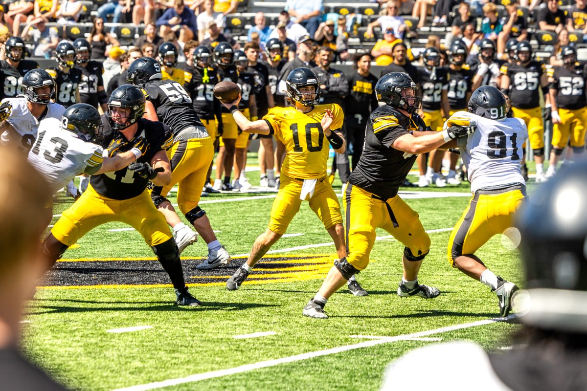 Iowa quarterback Jeremy Hecklinski goes to throw the ball during football open practice at Kinnick Stadium in Iowa City on Saturday, April 25, 2026. The Iowa Hawkeyes host the Northern Illinois Huskies on Sept. 5 with the time yet to be announced.