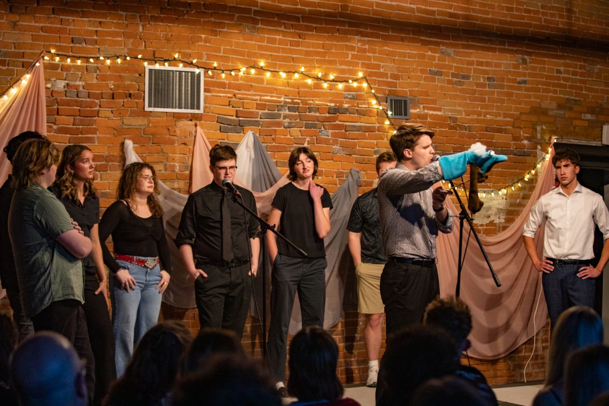 The Cast of ‘Who Even Told you That?’ perform their sketch ‘General Goes to Grief Counseling’ on Saturday, April 25, 2026 in Iowa City, Iowa. A comedy sketch troupe called ‘Who Even Told You That?’ performed sketches at the Iowa Conservatory Theater in Iowa City, Iowa on April 24 and 25, 2026. (Sarah Hughes/The Daily Iowan)