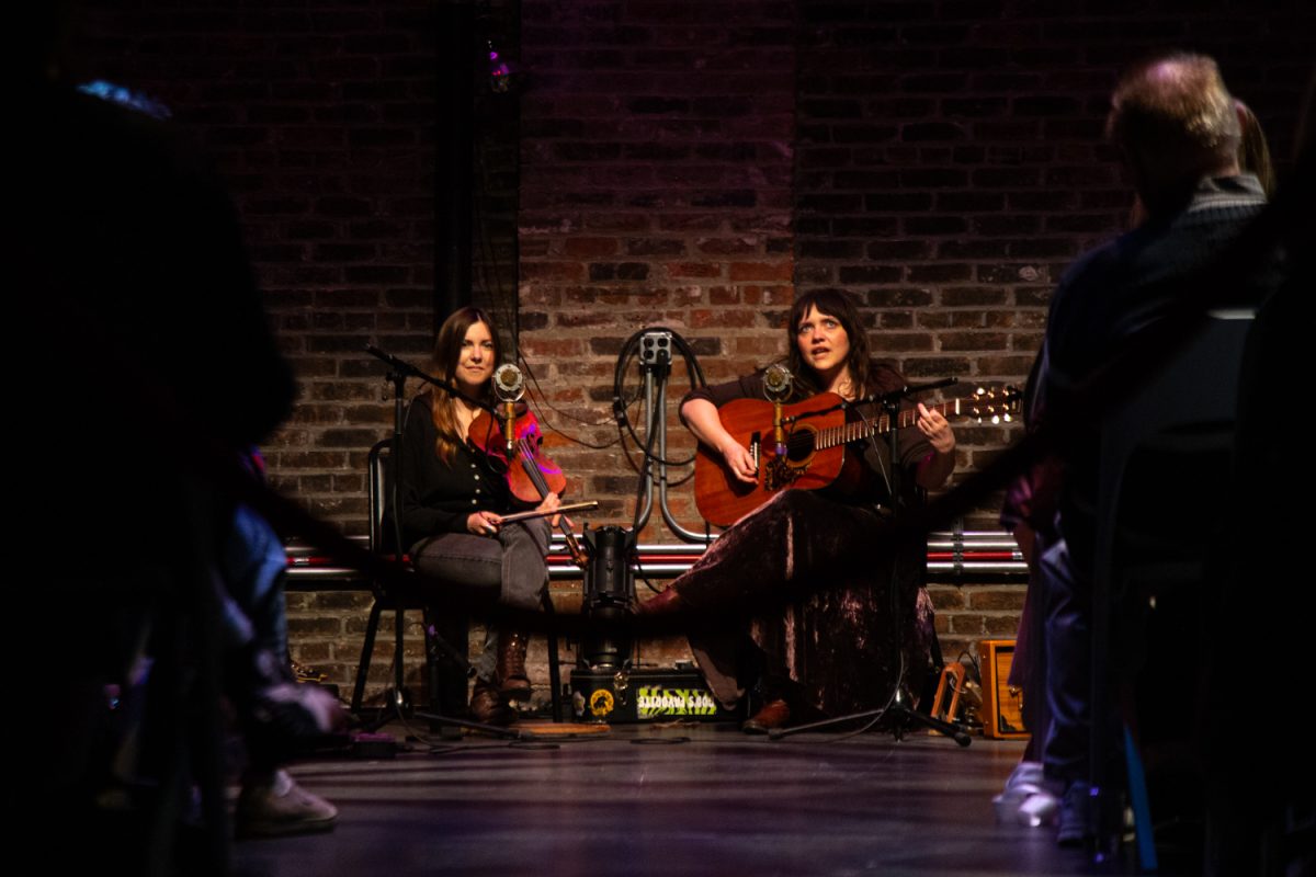 Mamas Broke performs in front of a crowd at the Englert Theater in Iowa City on Wednesday, April 29, 2026. The duo has won many awards, including the Canadian folk music award for Ensemble of the Year in 2017. (Dexter Westbay/ The Daily Iowan)