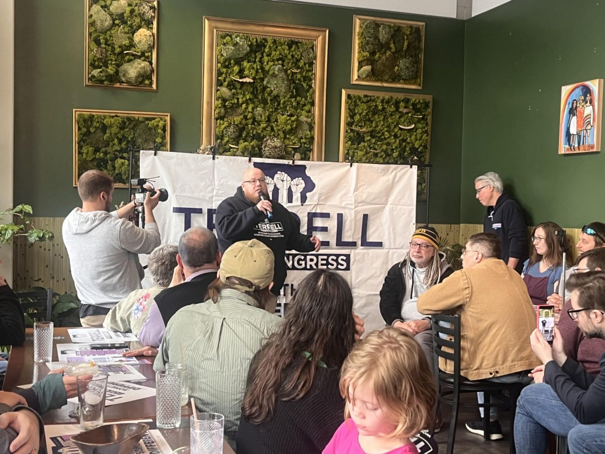 Travis Terrell speaks at a The Green House in Iowa City on April 11, 2026 for a fundraising event with Johnson County Supervisor Jon Green. Terrell is running for a seat in the 1st Congressional District.