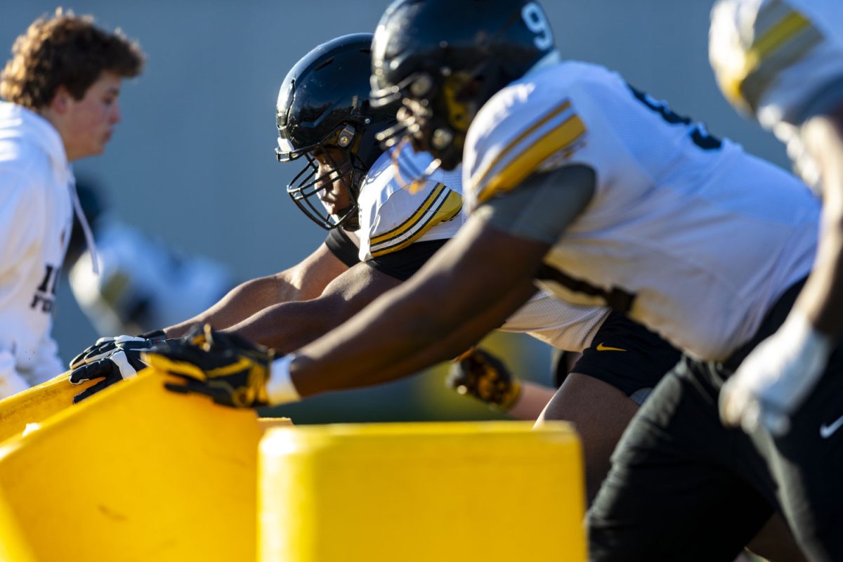 Iowa defensive lineman Emmanuel Olagbaju pushes a bin during an open practice for the media at the Ronald D. and Margaret L. Kenyon Football Practice Facility on Thursday, April 9, 2026. Open practice for fans is set for April 25 in Kinnick Stadium, gates open at 9:45am CST. (Samantha DeFily/The Daily Iowan)