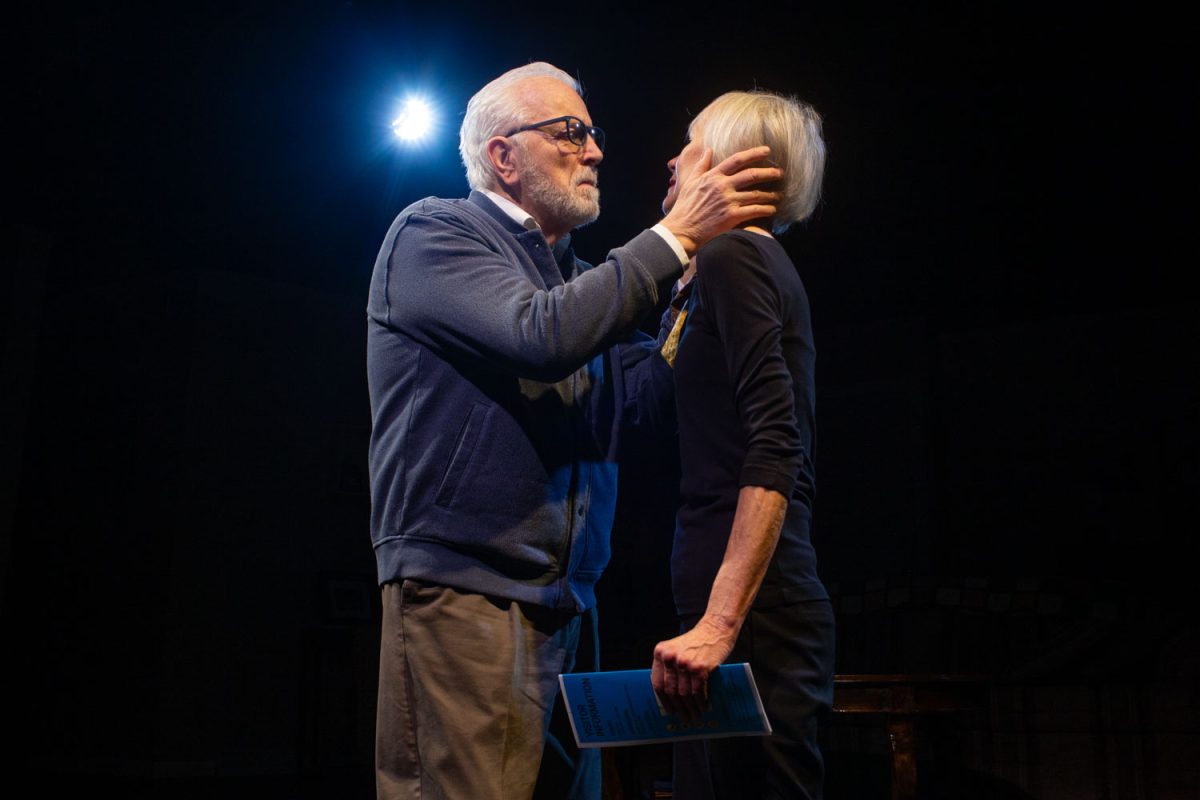 Ron Clark and Jody Hovland’s elderly widow and widower Doug and Bea share an intimate moment during “The Fiancé,” a play by Emily Bohannon directed by Adam Knight at Riverside Theatre on Wednesday, April 15, 2026. Riverside Theatre is celebrating its 45th anniversary this year. Original founders Clark and Hovland continue to act in modern productions. (Ava Neumaier / The Daily Iowan)