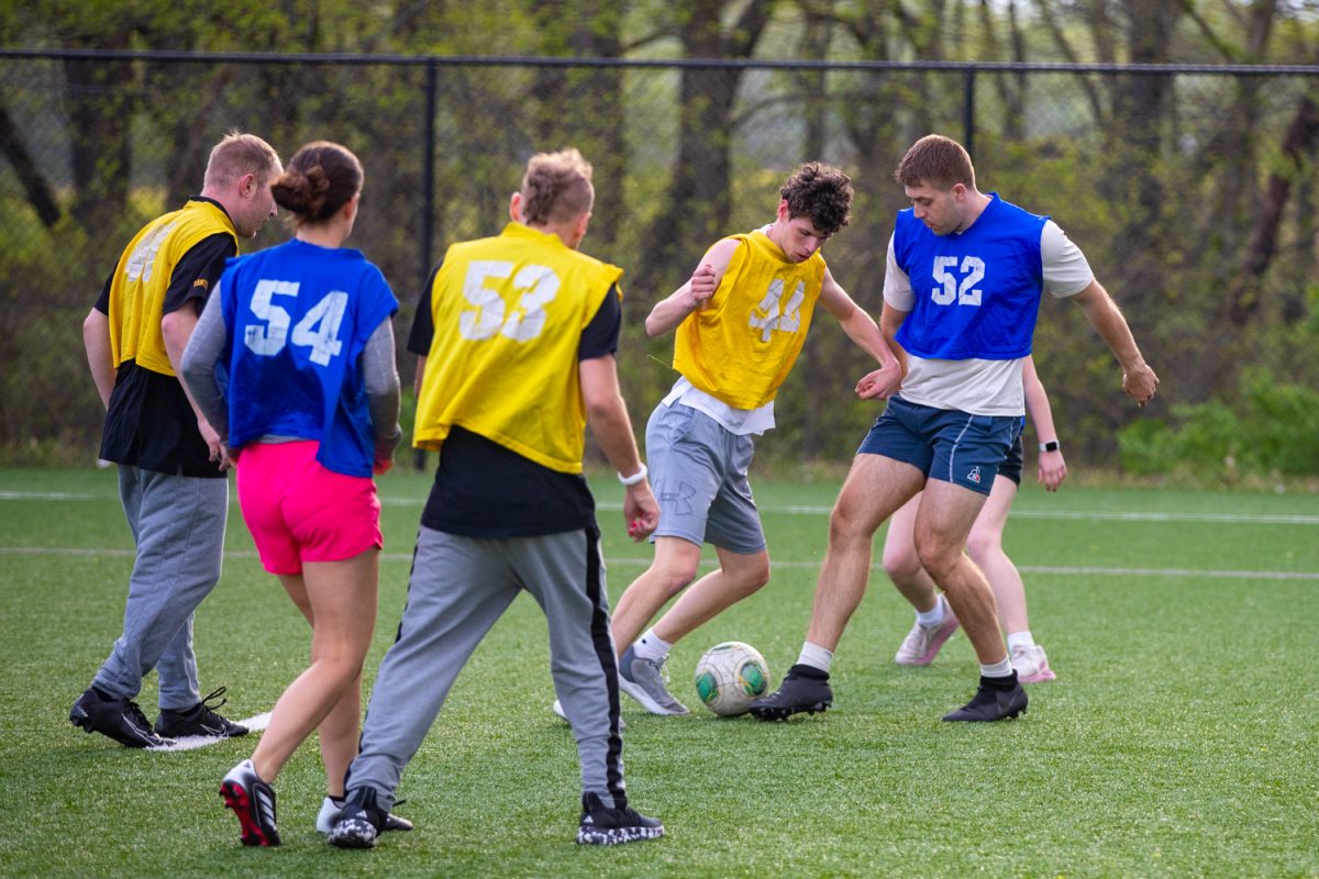 The Unified sports players are seen fighting for the ball at the Hawkeye Recreation Fields in Iowa City, Iowa on Monday, April 27, 2026. The University of Iowa has an intramural program ‘Unified Sports’ for individuals with and without disabilities, helping form friendships and create a sense of acceptance. (Sarah Hughes/The Daily Iowan)