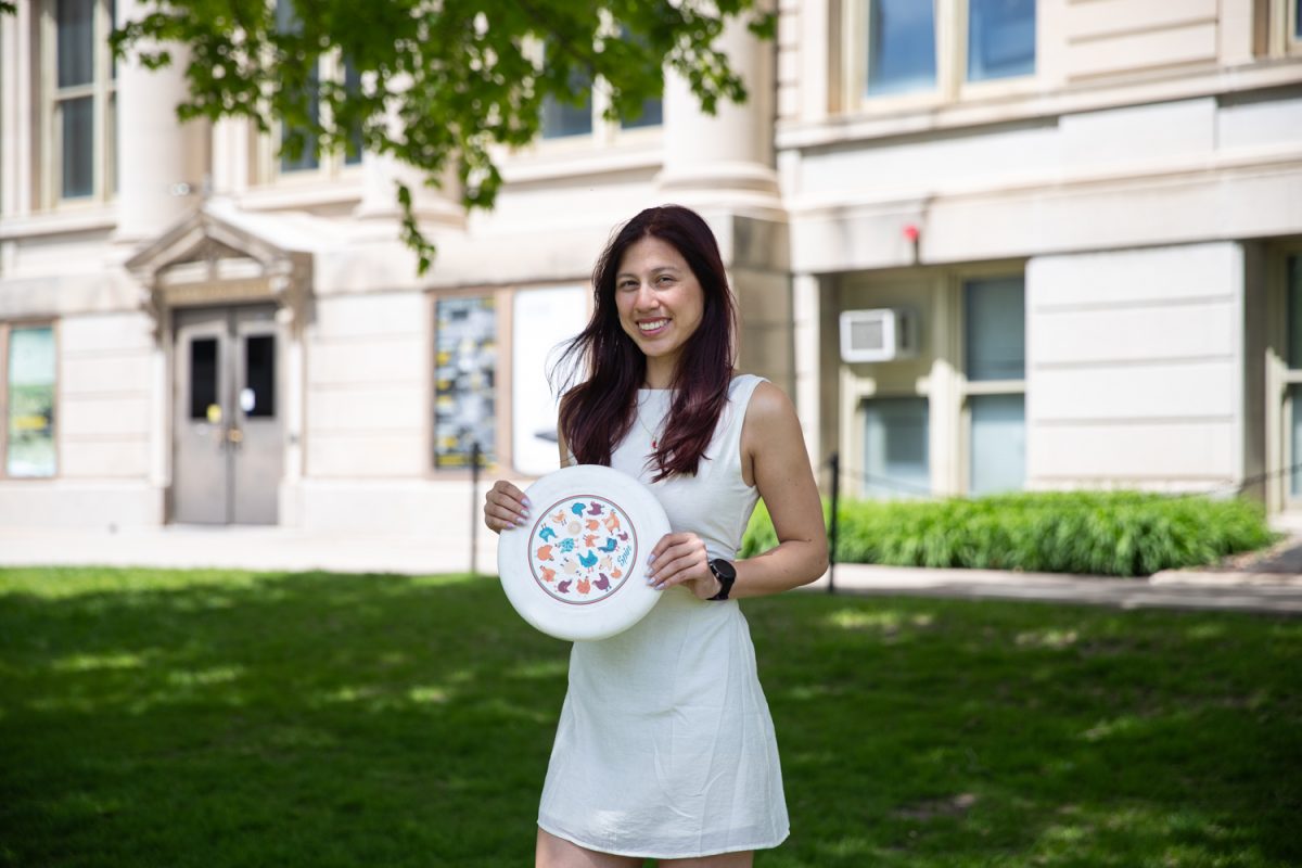 Kaili Decker poses for a photo on the pentacrest on Sunday, May 3, 2026. Kaili is a senior and is on the Iowa ultimate frisbee team. (Dexter Westbay / The Daily Iowan)