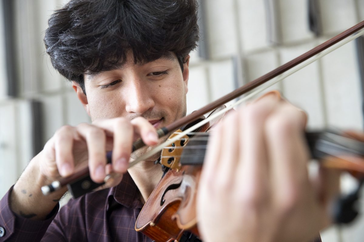 Oliver Bostain poses for a portrait in Voxman Music Building in Iowa City, IA, on Wednesday, May 6, 2026. A senior in the music performance program, Bostain completed his senior recital on Violin on Sunday, May 3. (Ethan McLaughlin/The Daily Iowan)