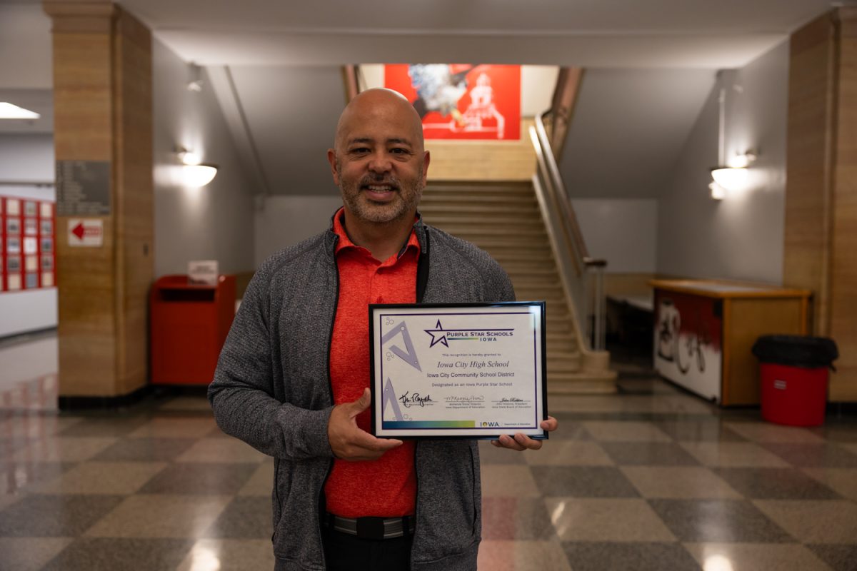 Russ Johnson, the Iowa City Community School District Career Coordinator, presents the Purple Star award, a certificate that recognizes ICCSD as a Purple Star district on Thursday, May 7, 2026 at Iowa City High School. (Liz Sleper / The Daily Iowan)