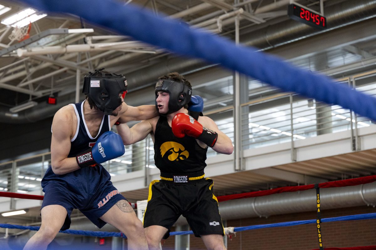 University of Illinois Urbana-Champaign boxer Trevor Gray goes to punch Samson Diener during the Iowa State Annual Boxing Show in the State Gym at Iowa State University in Ames, Iowa on Saturday, Feb. 21, 2026. Diener won the bout in a referee’s decision. (Samantha DeFily/The Daily Iowan)