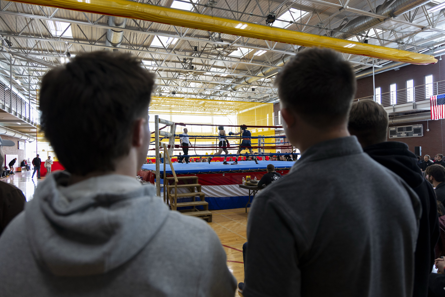Samson Diener and Iowa Boxing Club President Maxwell Borkowicz watch a developmental round during the Iowa State Annual Boxing Show in the State Gym at Iowa State University in Ames, Iowa on Saturday, Feb. 21, 2026. This event was formally called Cyclone Throwdown. (Samantha DeFily/The Daily Iowan)