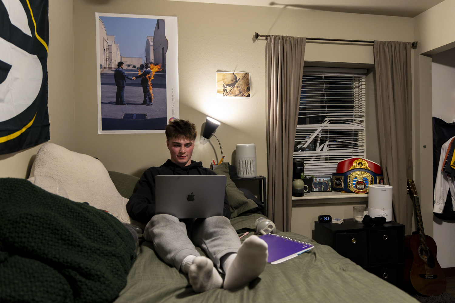 Samson Diener goes through his calendar in his room at the Pi Kappa Phi house in Iowa City, Iowa on Tuesday, March 3, 2026. Diener currently has his own room in the frat and plans to move into a three bedroom apartment next year. (Samantha DeFily/The Daily Iowan)