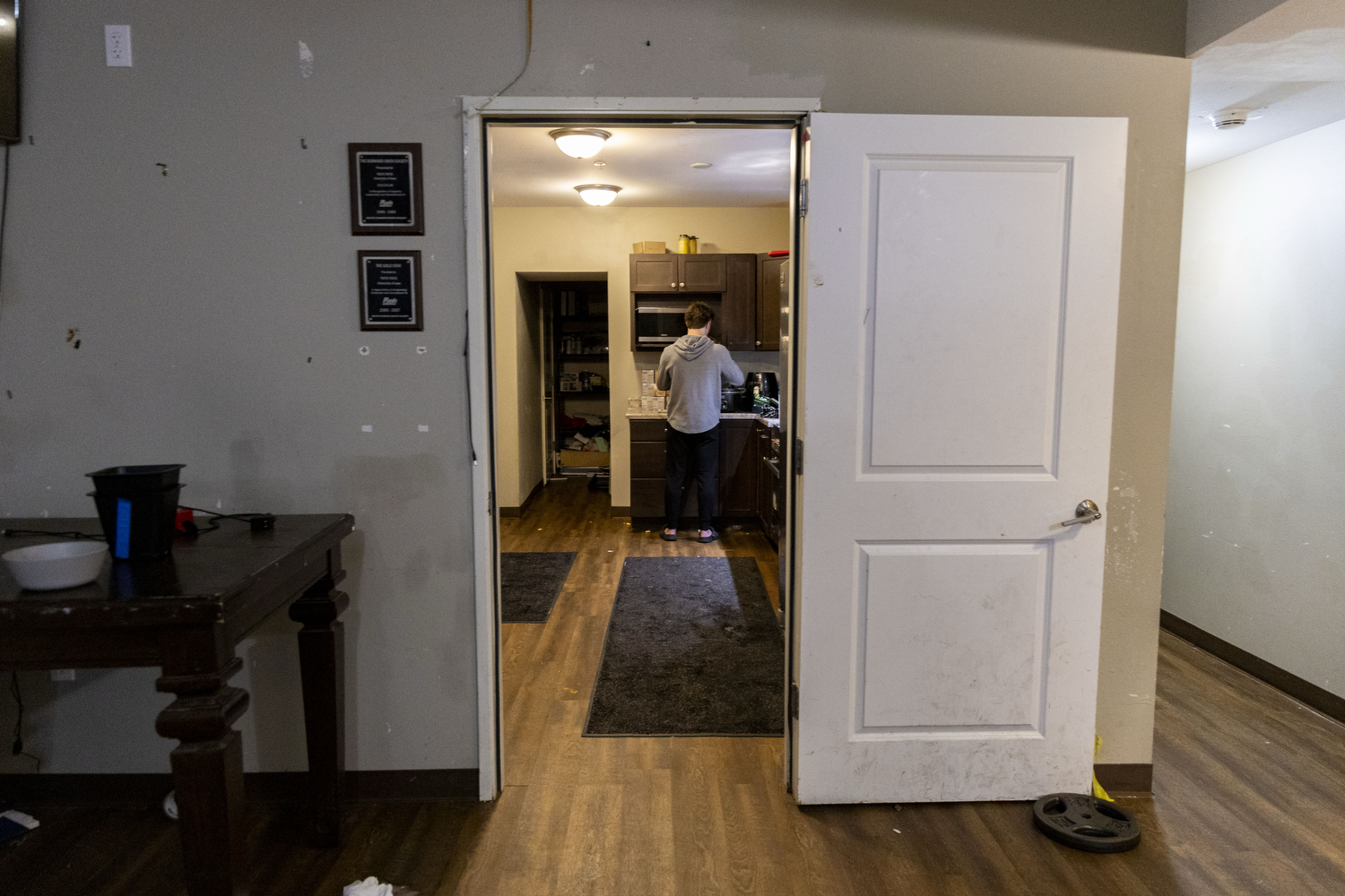 Samson Diener meal preps in the Phi Kappa Pi kitchen in Iowa City, Iowa on Monday, March 9, 2026. Diener hides his crockpot in his room so that his frat brothers don’t use it. (Samantha DeFily/The Daily Iowan)