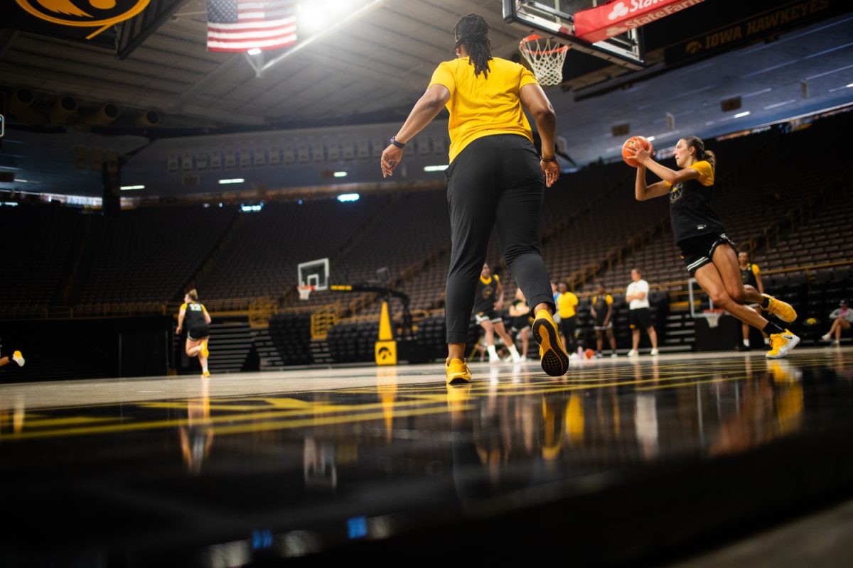Iowa assistant coach Lasondra Barrett watches her players run down the court in a practice match during a University of Iowa Women’s Basketball media day at Carver-Hawkeye Arena on Tuesday, July 7, 2026.
